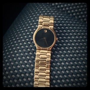 Mavado gold band with black face